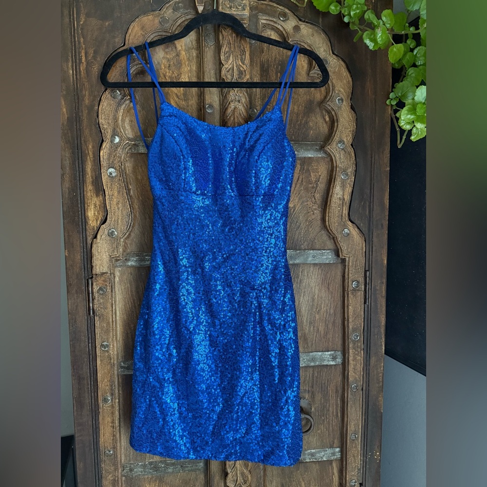Blue Sequin royal blue lace up a line mini dress. Size 2 built-in cups.